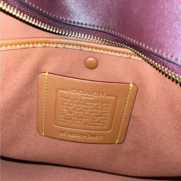 Coach 48 Merlot Empire has seen some world! Too big of a bag for me! - Picture 5 of 10